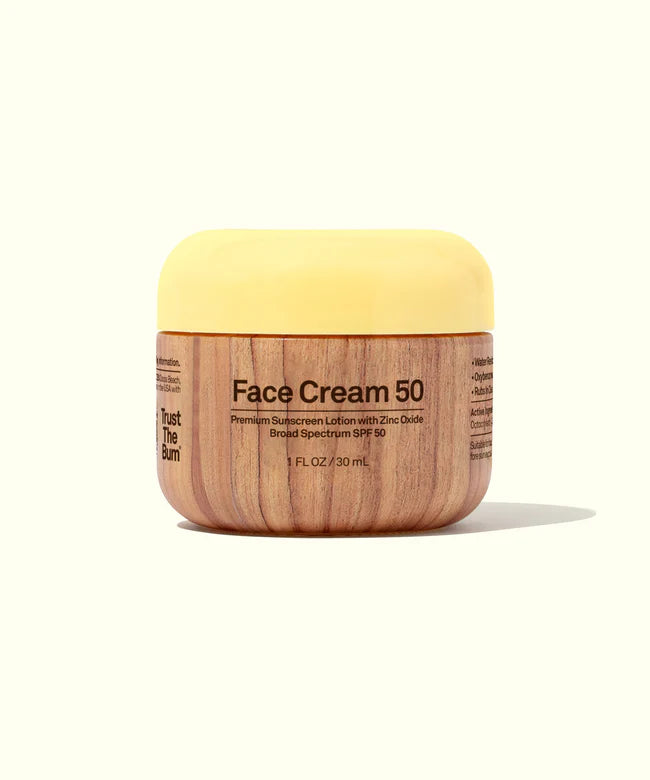 Sun Bum Face Cream 50 SPF in wood-grain jar with yellow lid offering broad spectrum sunscreen protection