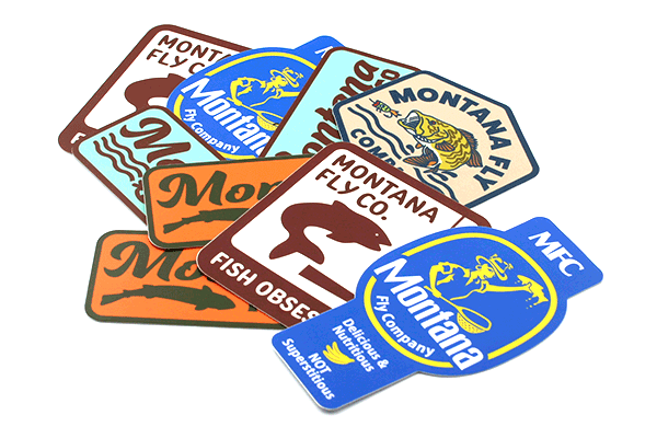 Montana Fly Company Stickers featuring colorful vinyl designs with fishing and outdoor themes at Freestone Fly Shop