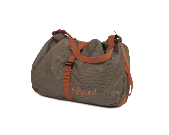 Fishpond Burrito Wader Bag with durable material and straps, designed for storing wet waders and boots after fly fishing trips