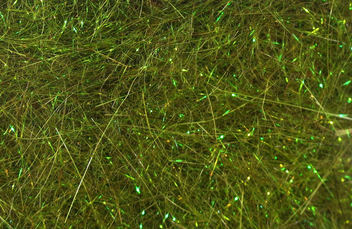 Hare's Ice Dub fibers in shimmering olive green with reflective strands for detailed fly tying at Freestone Fly Shop