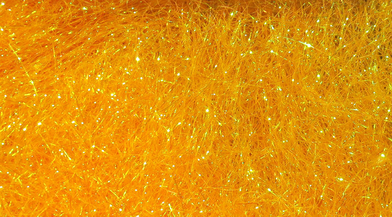Ice Dub fibers in bright orange with sparkling iridescence by Hareline Dubbin, Inc at Freestone Fly Shop for fly tying