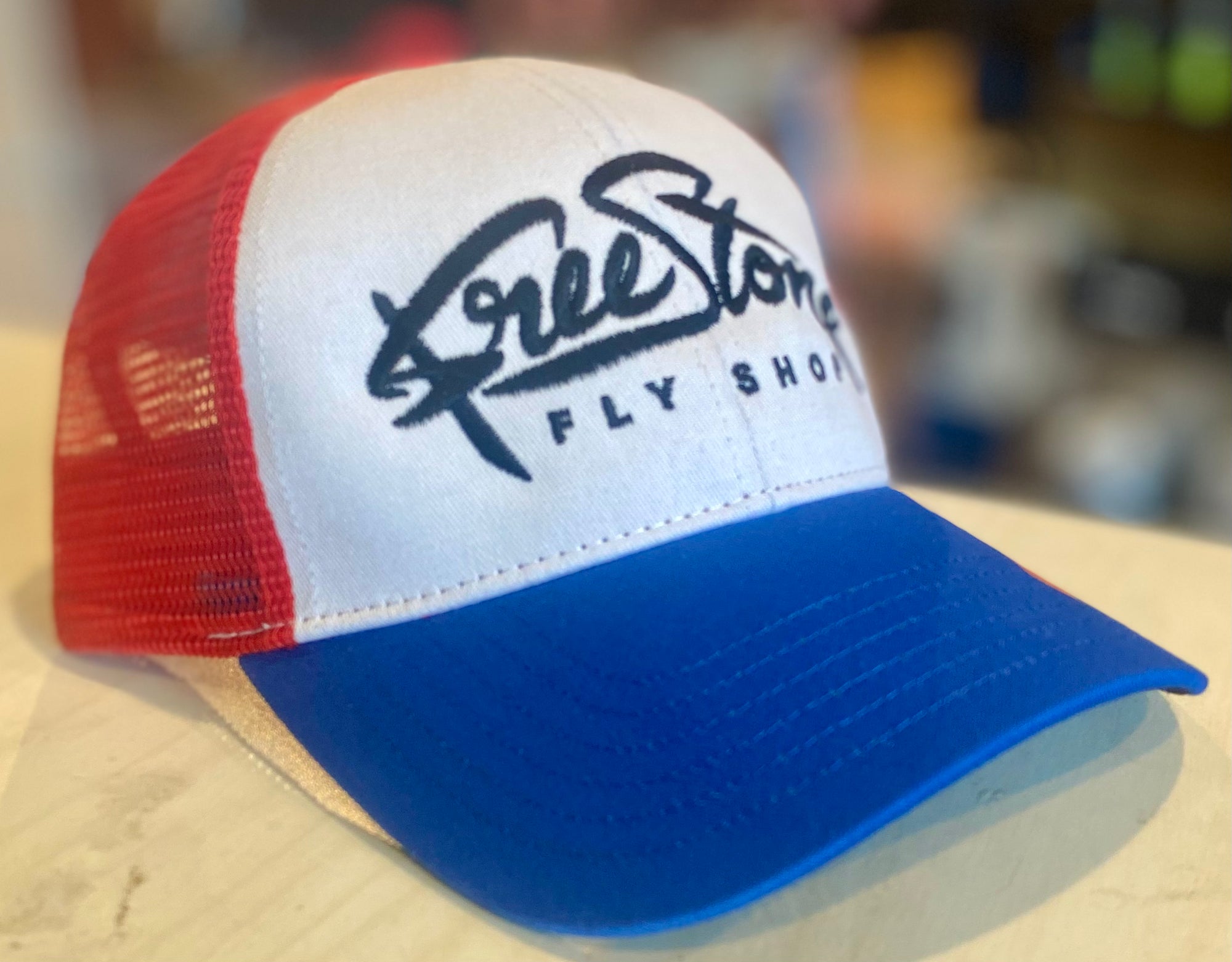 Simms Freestone Logo Trucker Hat - Red/Wht/Blue with adjustable snap and mesh back by Simms Fishing Products at Freestone Fly Shop