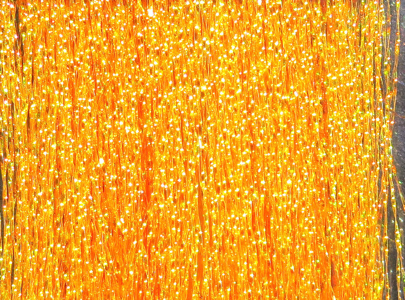Krystal Flash in bright shimmering amber with sparkling reflective fibers by Hareline Dubbin, Inc for fly tying