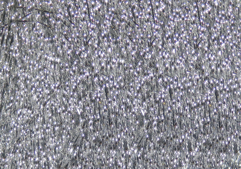 Krystal Flash strands in sparkling silver with reflective shimmer by Hareline Dubbin, Inc for fly tying at Freestone Fly Shop