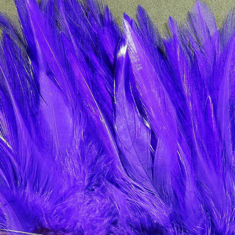 Strung Chinese 5-7 inch Saddle by Hareline Dubbin, Inc in vibrant purple for fly tying at Freestone Fly Shop