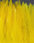 Strung Chinese 5-7 inch Saddle feathers in bright yellow by Hareline Dubbin, Inc for fly tying at Freestone Fly Shop